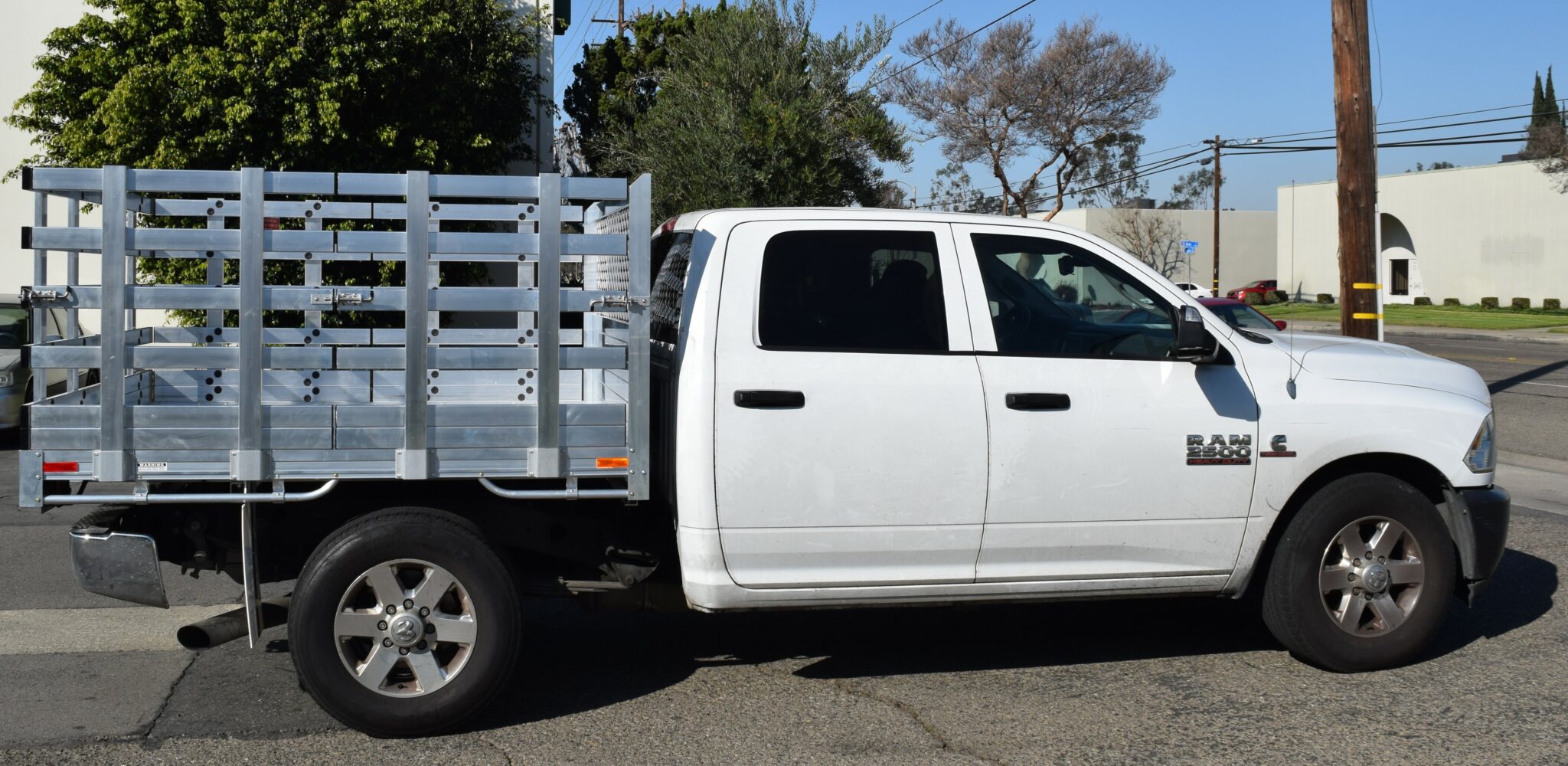 2014 Ram 2500, 6'6''x7' aluminum stake bed with 38'' lift out stakes using the factory bumper
