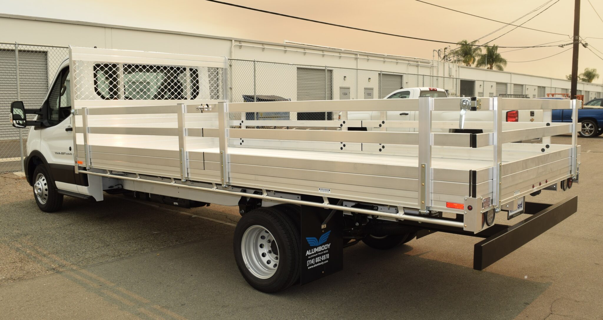 2020 Ford Transit 76x16 aluminum flatbed with 22 fold down gates and dock bumper