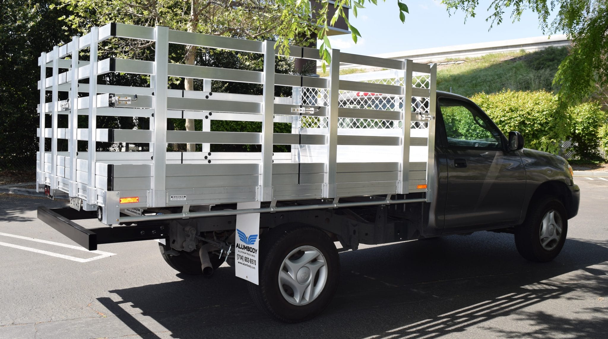 2006 Toyota Tacoma with a 6'X6'6" AlumBody flat bed, 22" fold-down gates using the factory bumper