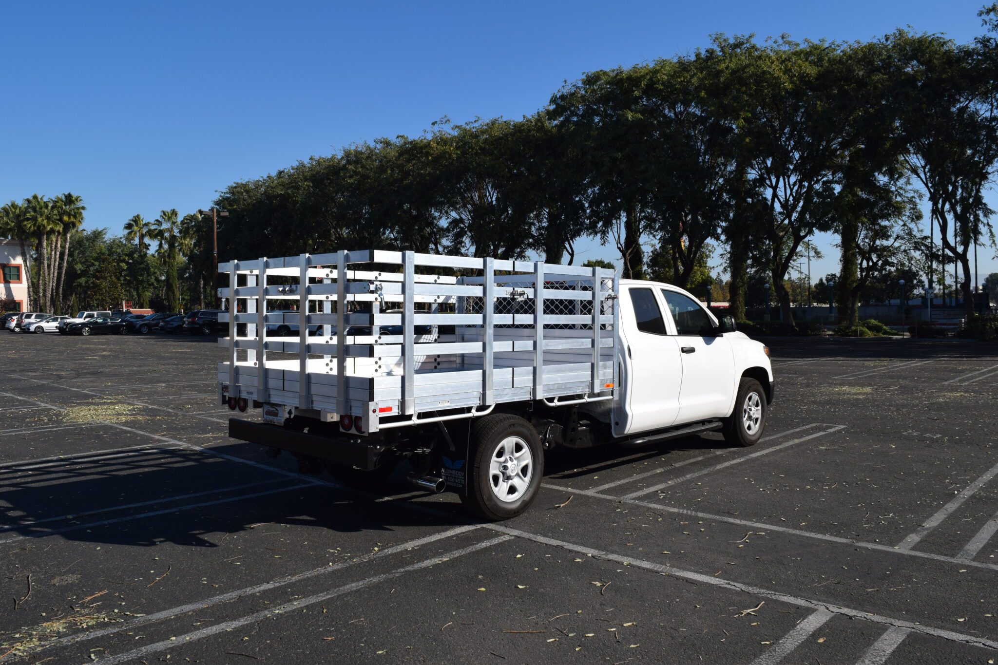 2010 Toyota Tundra with a 6'6" X 9' AlumBody aluminum stake bed, 30" lift-out stakes and dock bumper