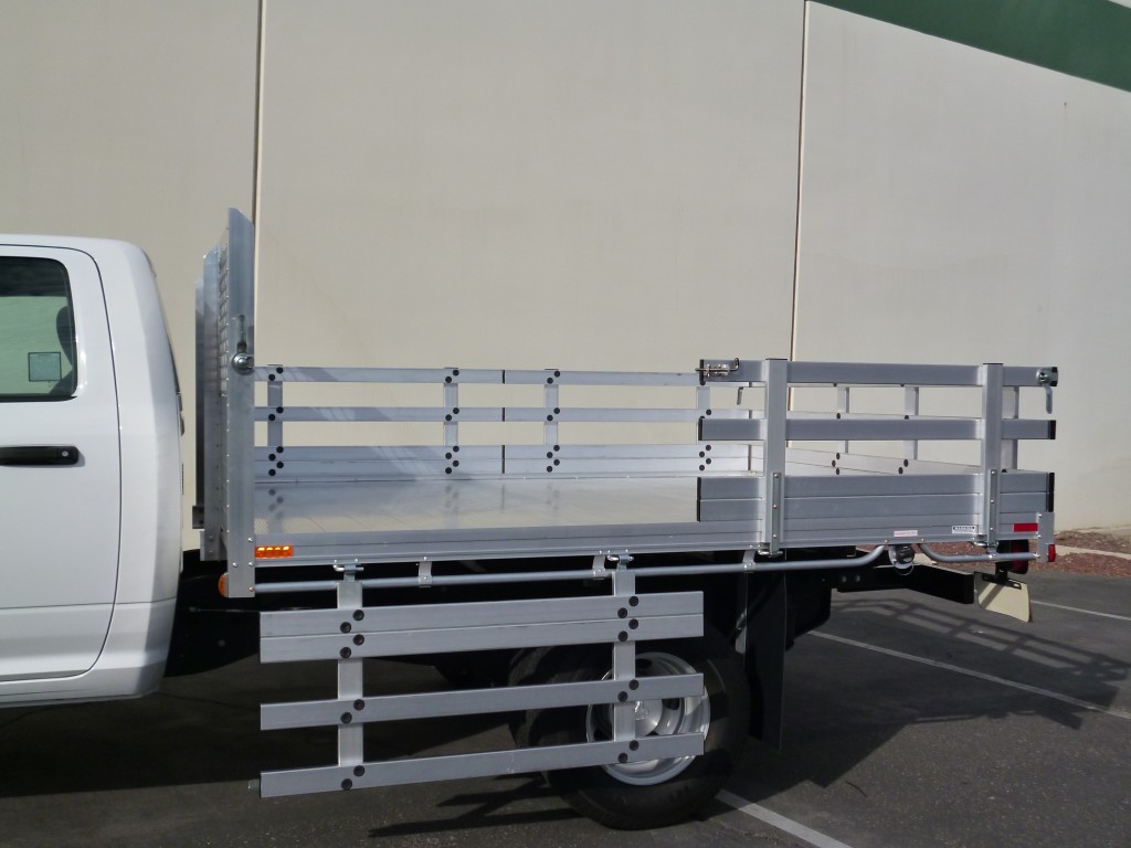 2015 GMC Sierra 3500 with an 8'x 10' aluminum body with 22'' fold down gates and a dock bumper