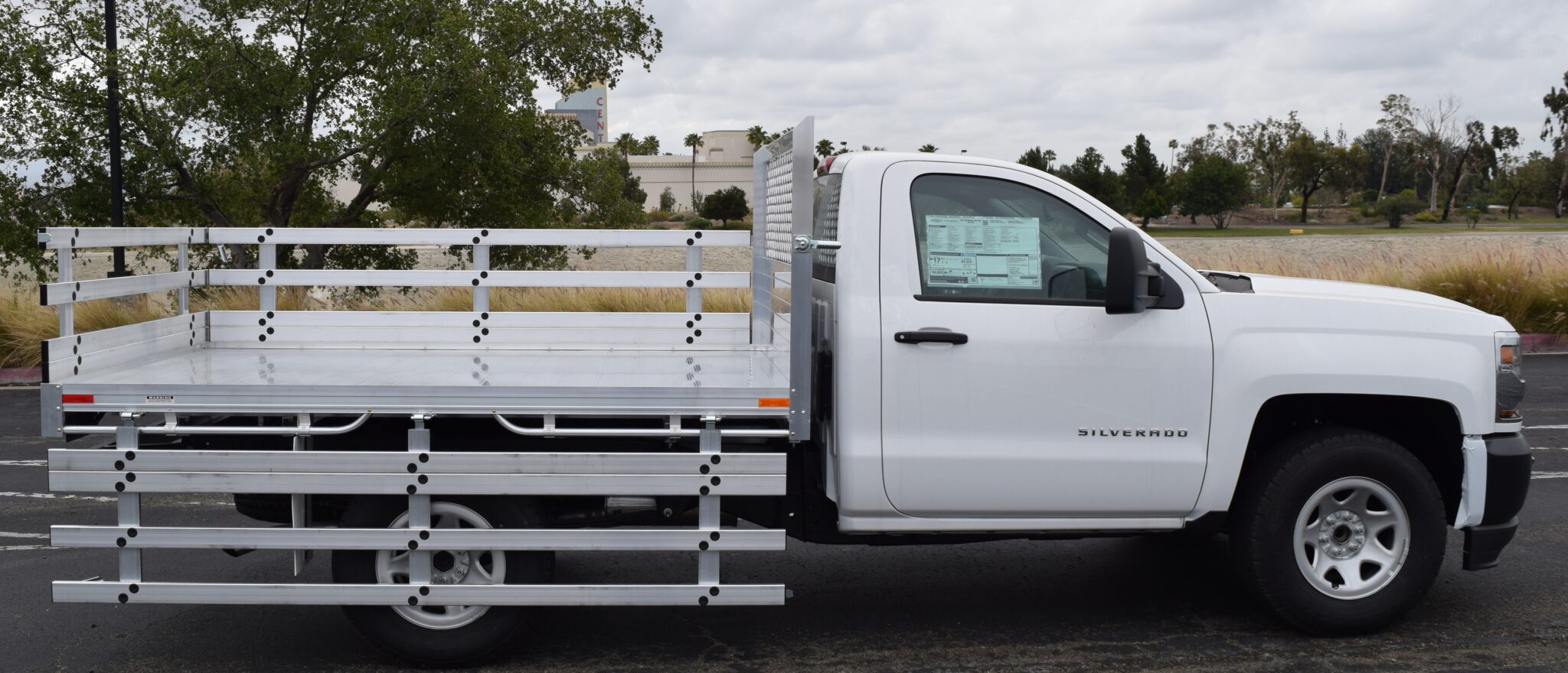 2016 Chevy Silverado 1500 66 X 9 with an aluminum flat bed 22 fold down gates using a dock bumper.