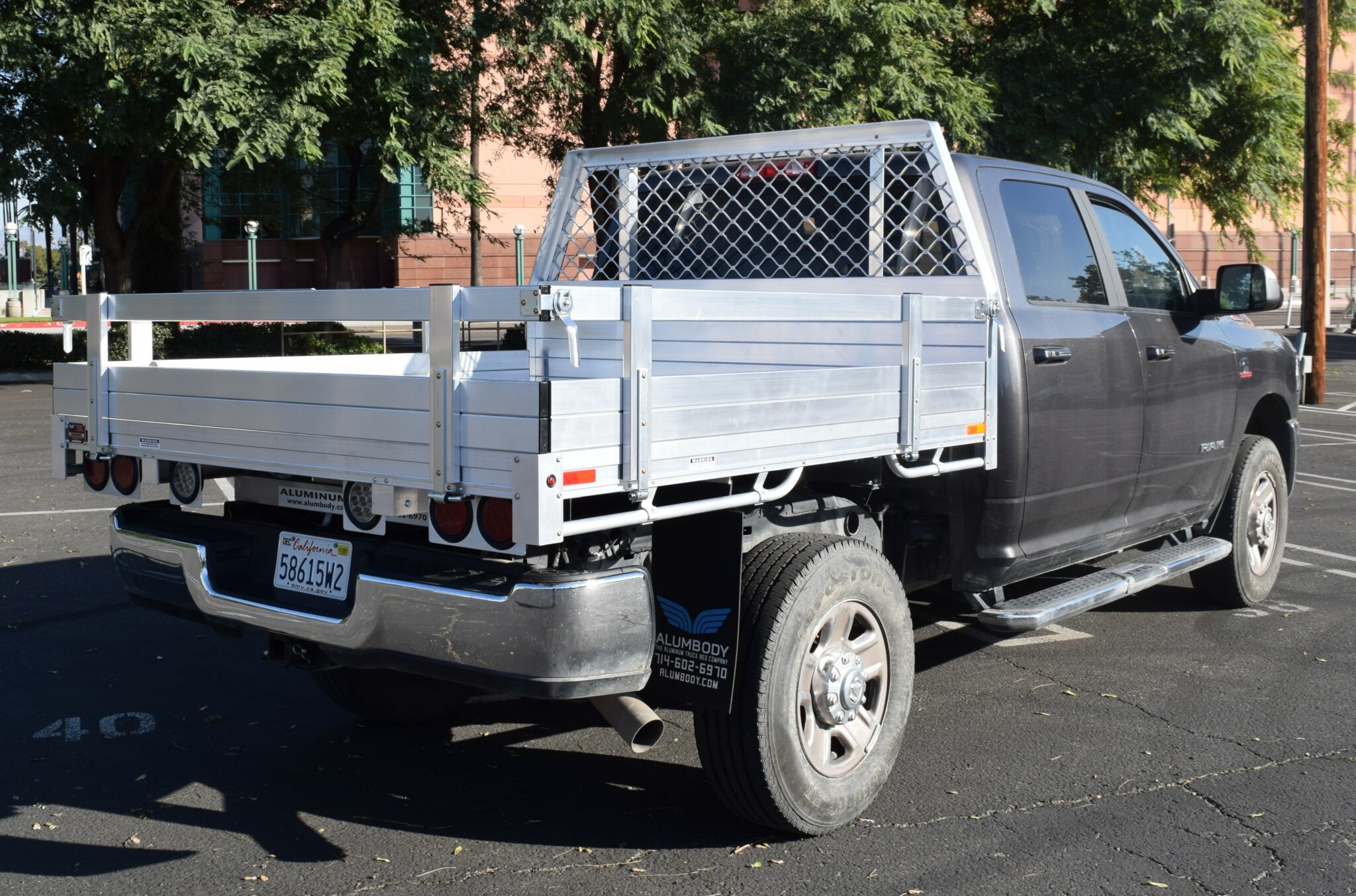 2019 Ram 2500, 6'6''X7' aluminum flatbed, with 14" fold down gates, a contour headboard, tie down rings using factory bumper