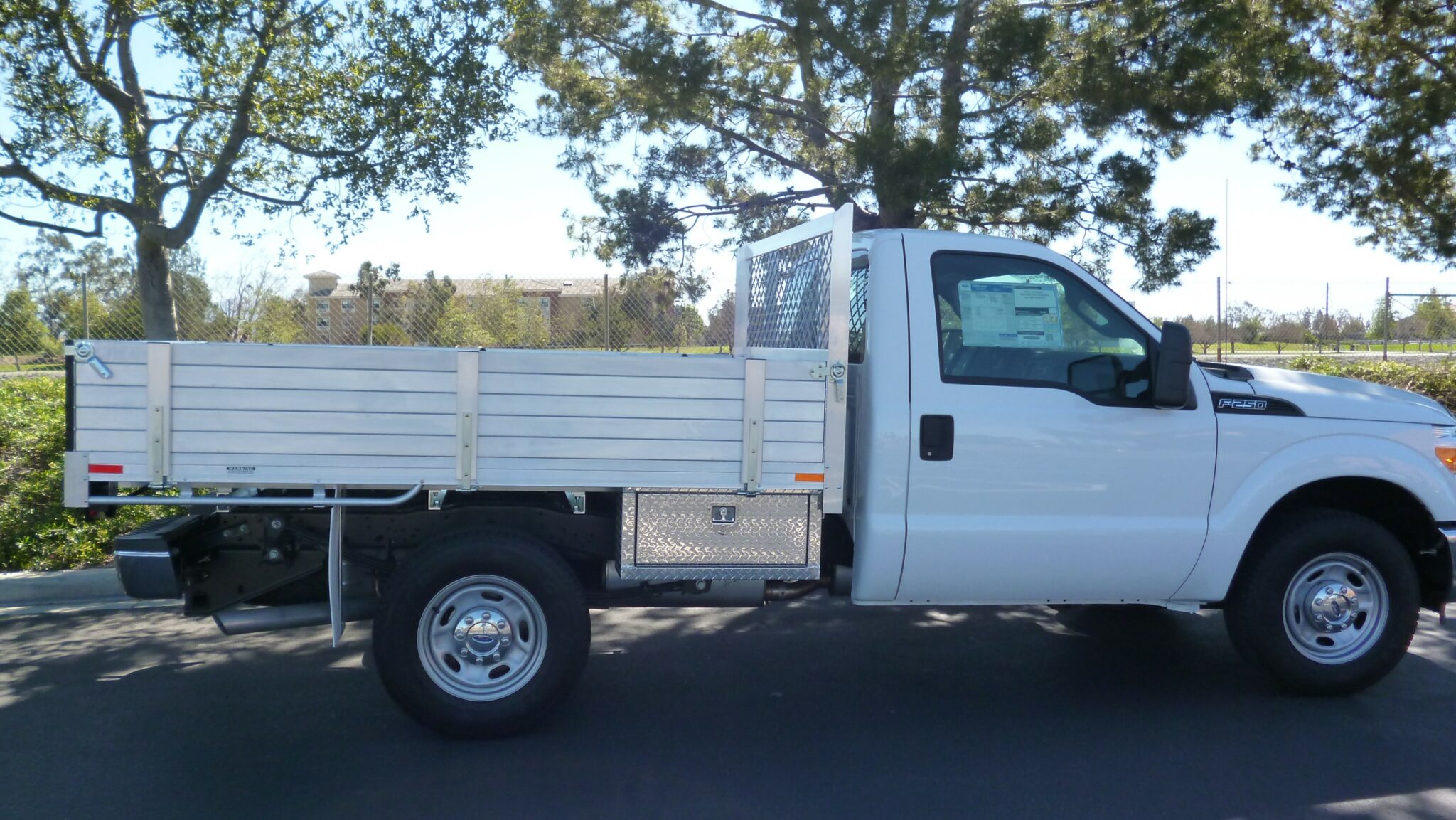 2015 F250 with a 7X9 aluminum body solid 15 fold down gates underbody tool box using the factory bumper