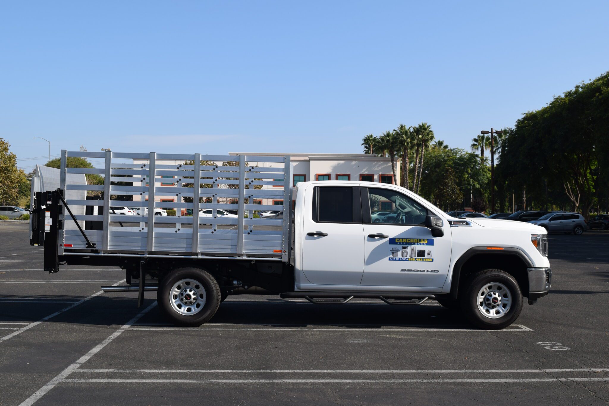 2021 GMC 3500 with a 7'X10' aluminum body, permanent 48'' sides and Tommy liftgate