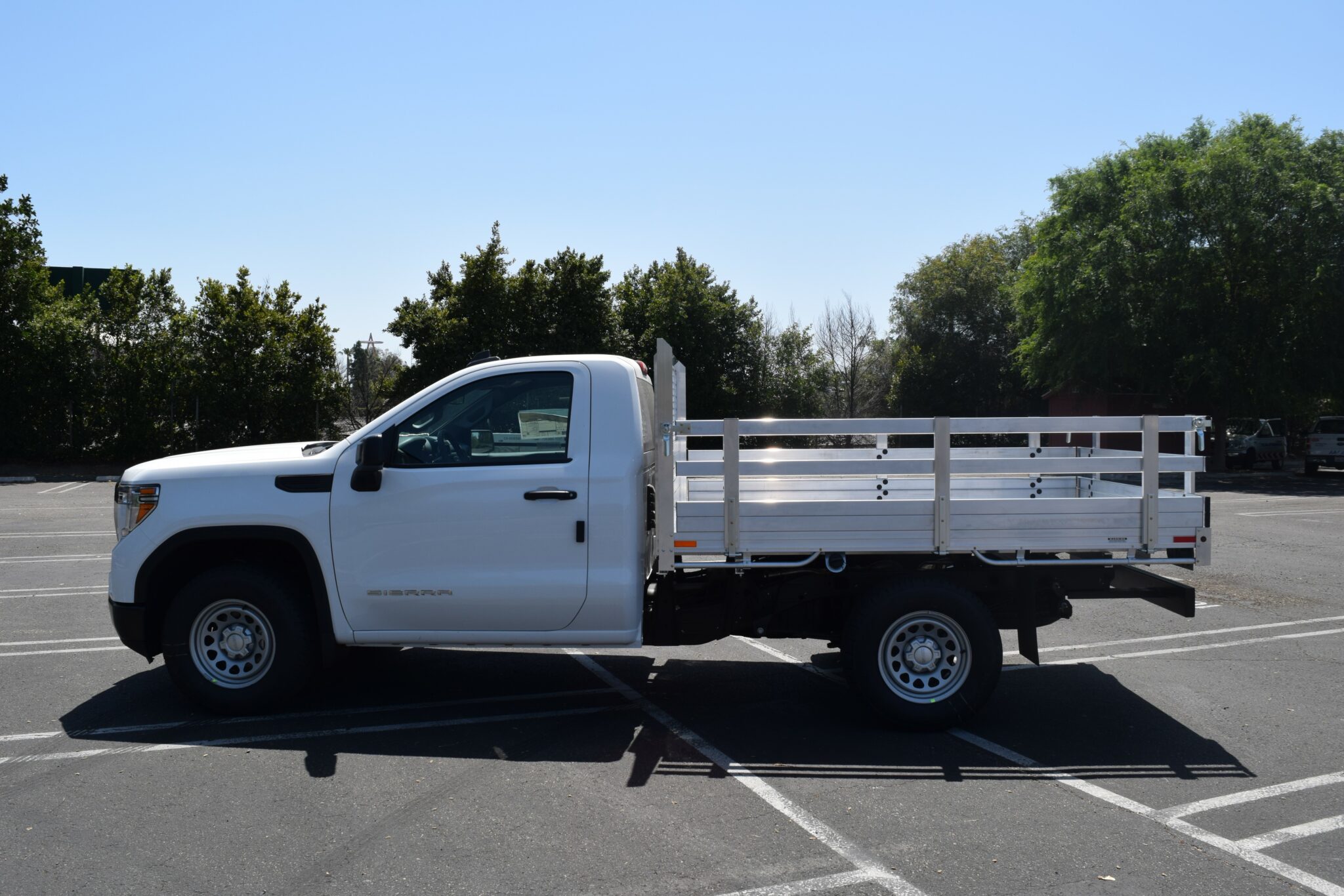 2021 GMC 1500, with a 6'6''x9' aluminum body, 22'' fold down gates and dock bumper