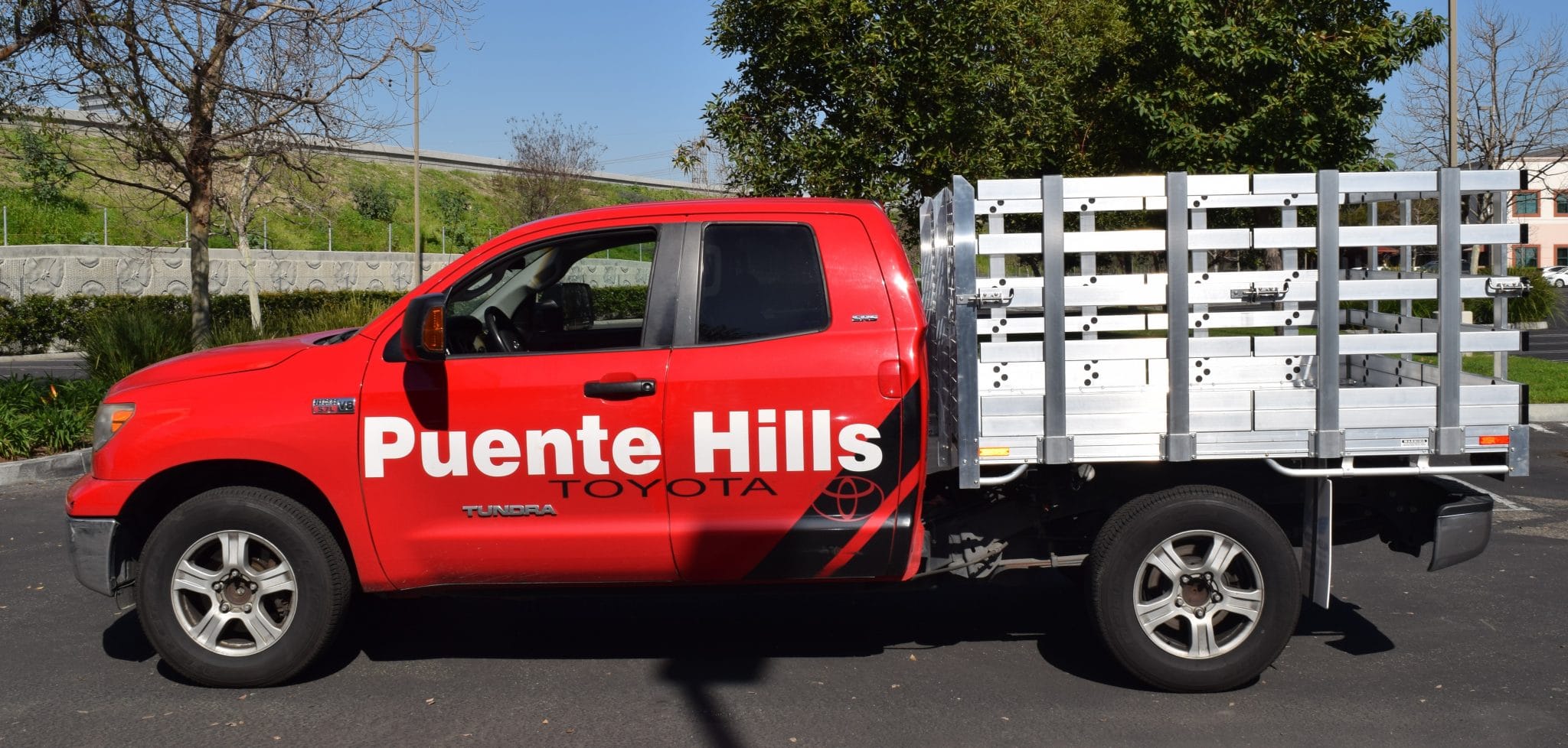 2009 Toyota Tacoma with a 6'X6'6" AlumBody flat bed, 22" fold-down gates using the factory bumper
