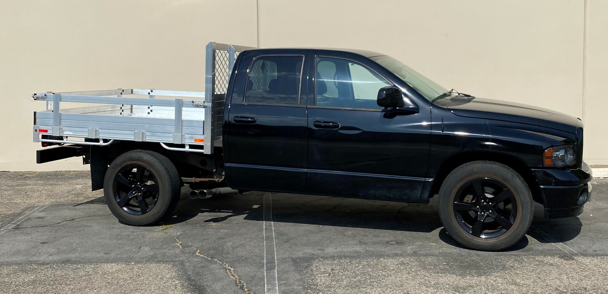 2005 Ram 1500, 6'6''x7' aluminum flatbed with 14'' lift out gates and dock bumper