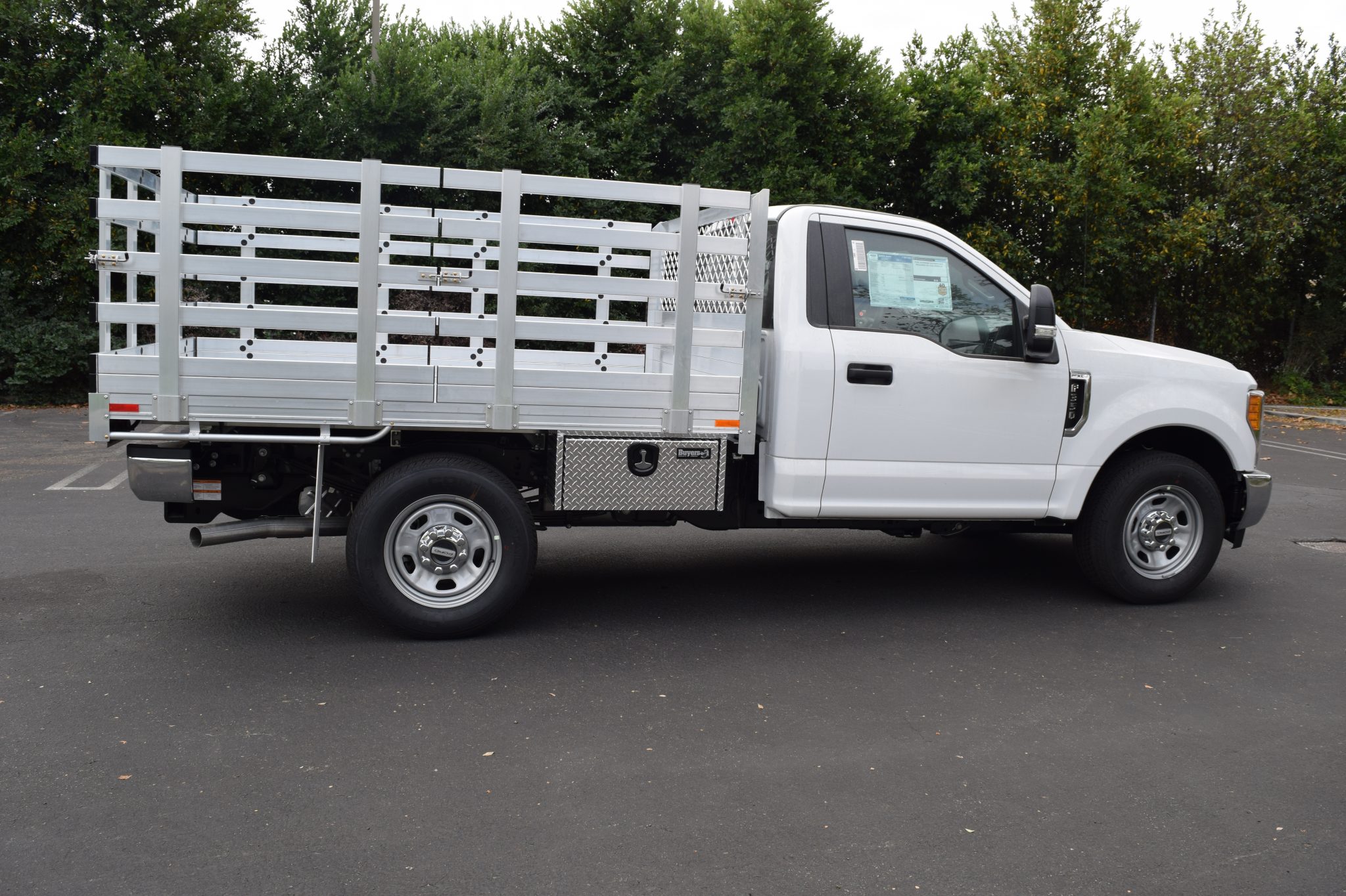 2018 Ford F250 with a 6'6" X 9' AlumBody aluminum stake bed with 38" lift out stakes 2 underbody tool boxes 14" X 12" X 30" using the factory bumper