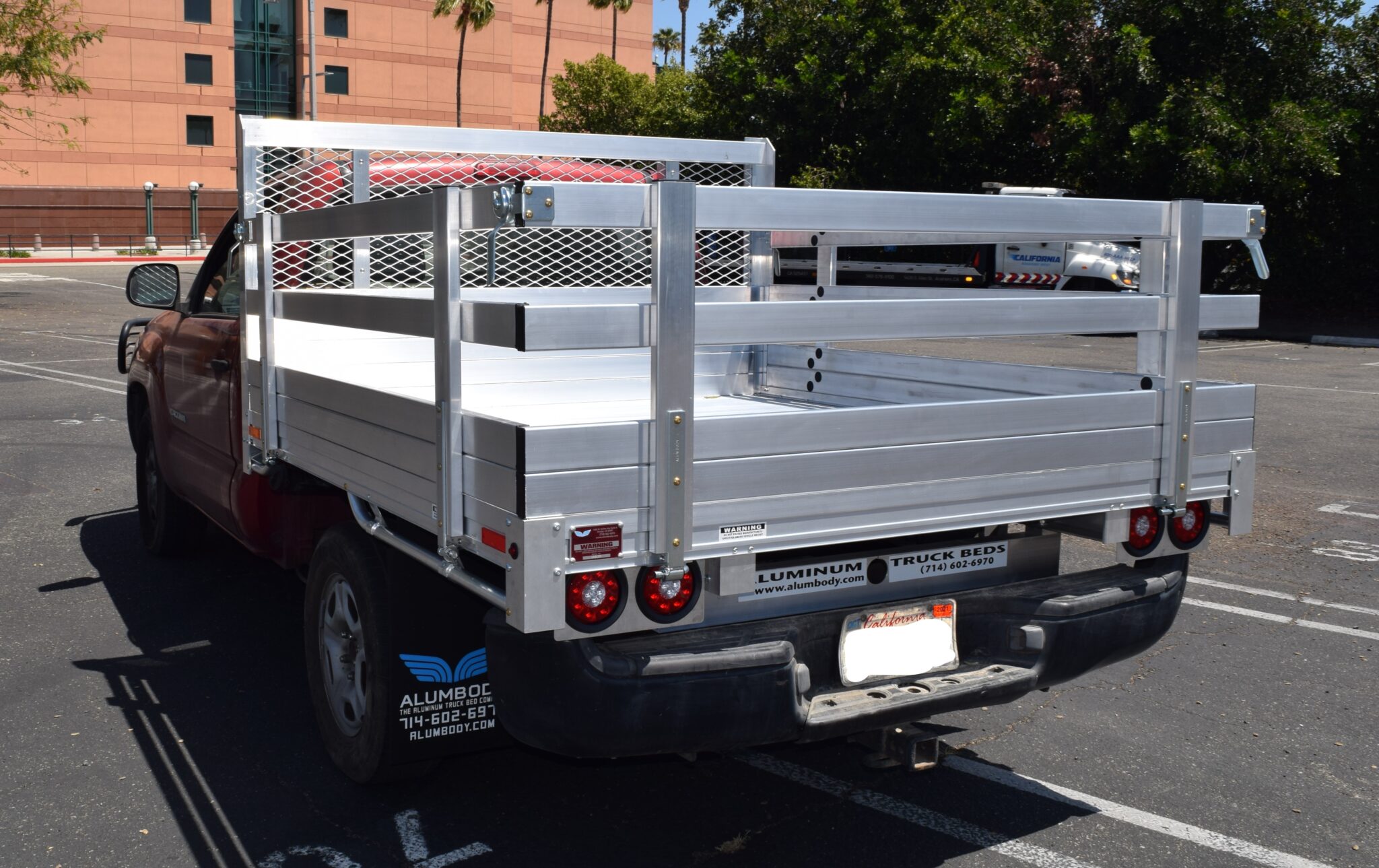 2014 Toyota Tundra with a 6'6" X 9' AlumBody aluminum stake bed, 30" lift-out stakes and dock bumper