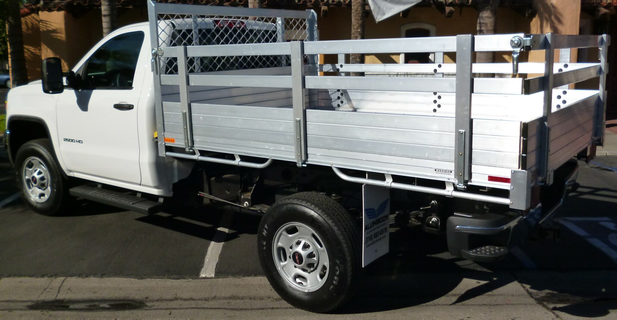 2014 GMC with a 6'6''x9' aluminum body, 25'' fold down gates using the factory bumper