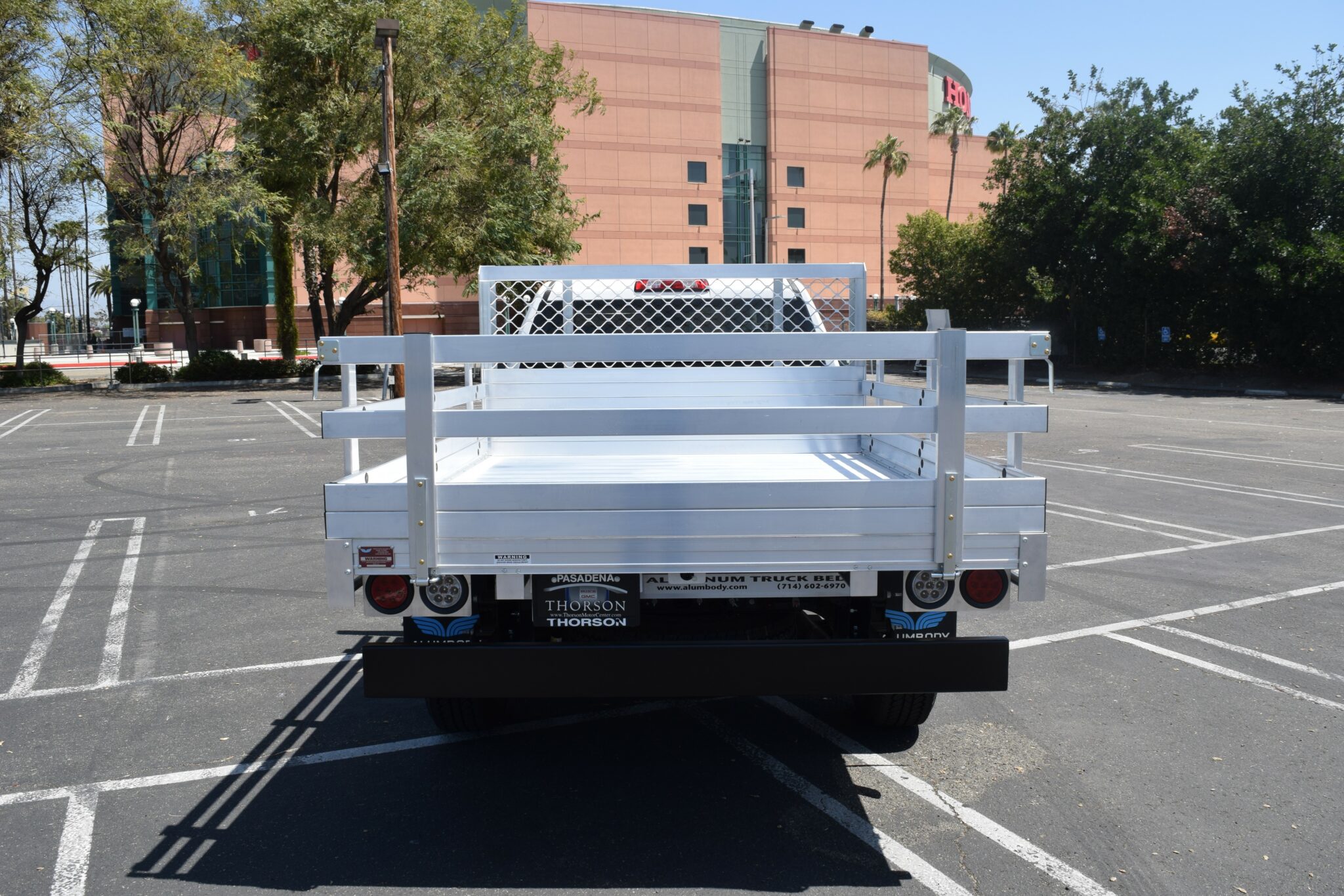 2021 GMC 1500 with a 6'6''x9' aluminum body, 22'' fold down gates and dock bumper