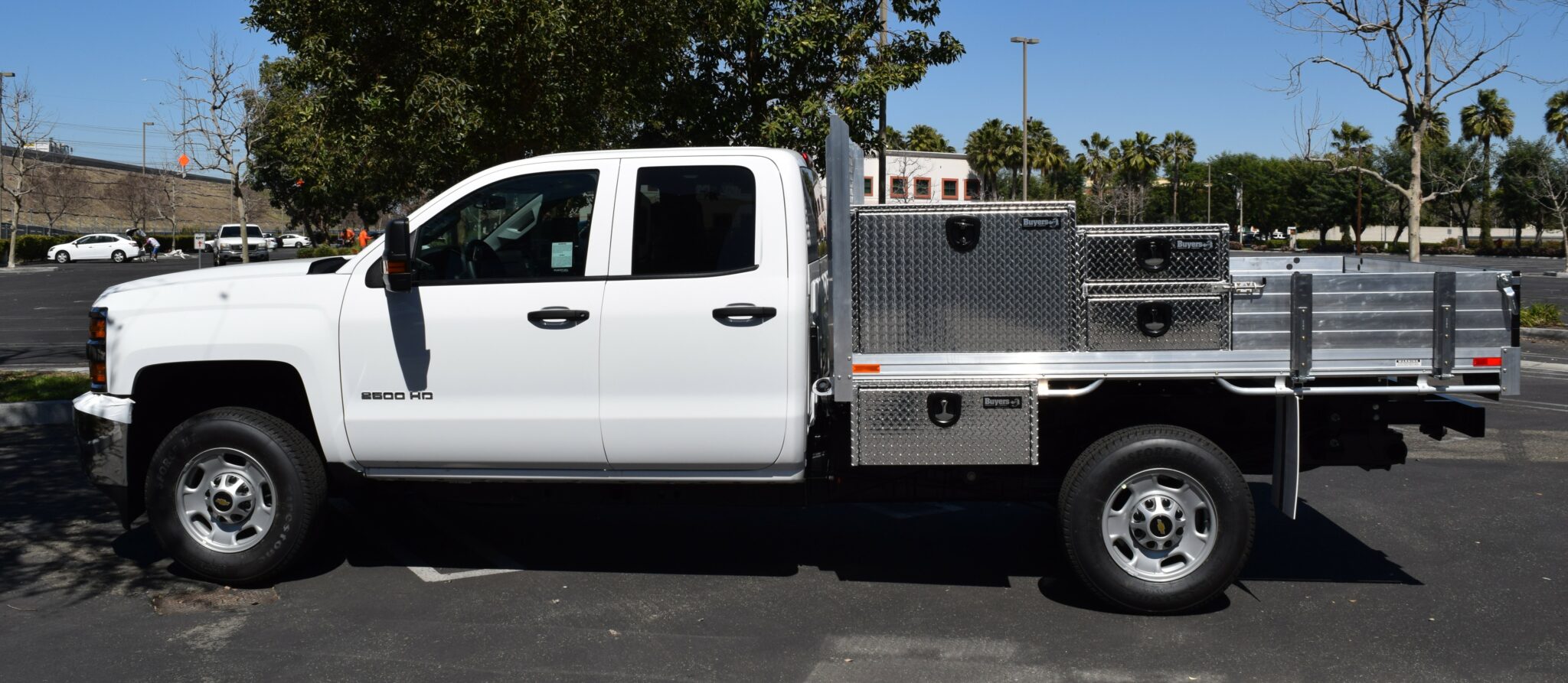 2018 Chevy Silverado 2500 66×9 aluminum flatbed with 12" custom fold-down gates, over-body tool boxes, underbody toolbox and dock bumper