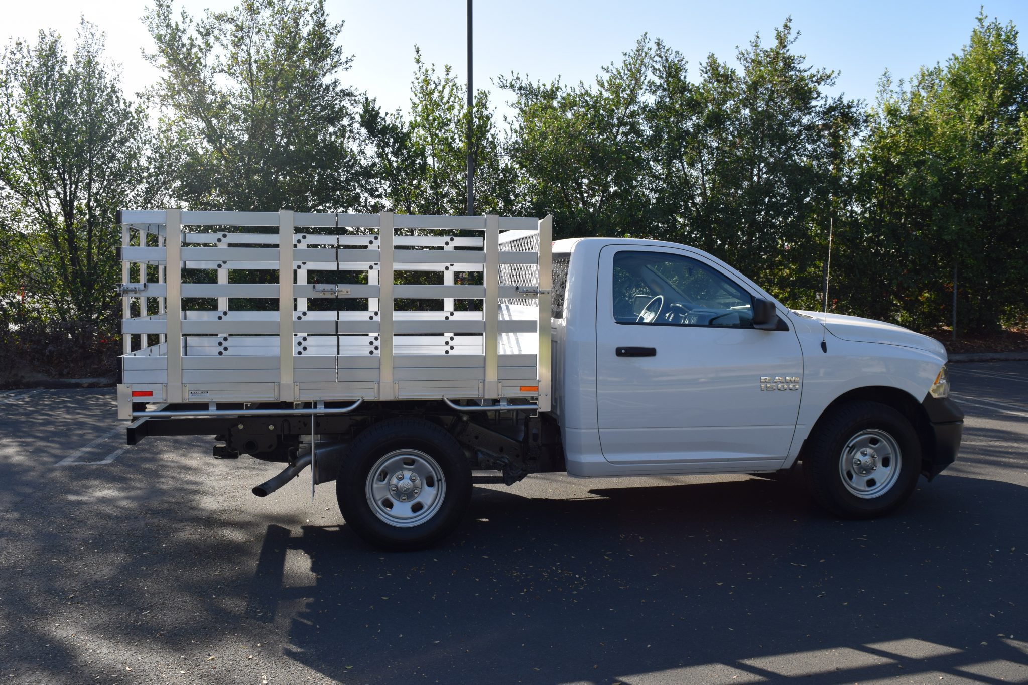 2015 Ram 1500 with a 6'6" X 7'6" AlumBody aluminum stake bed with 38" lift out stakes and dock bumper