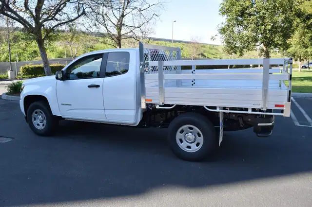 2017 Chevy Colorado with a 6' X 66" Alumbody aluminum flat bed with 22" fold down gates using the factory bumper