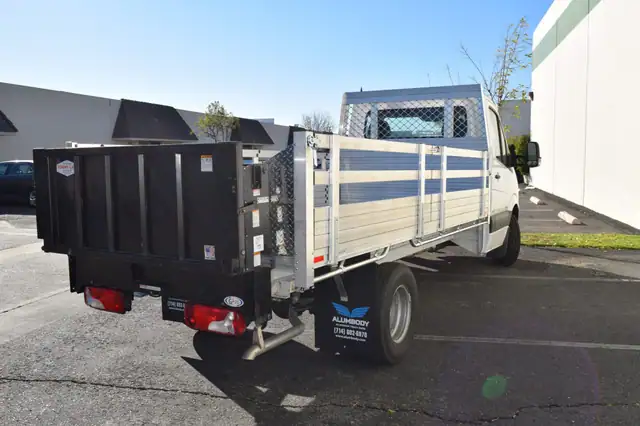 2004 MB Sprinter 3500 6'6''x13'6'' 25'' fold down sides Taper Headboard and Lift Gate in the rear