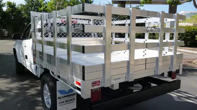 2015 Chevy Colorado with a 6' X 7' Alumbody aluminum stake bed with 30" lift out stakes and dock bumper