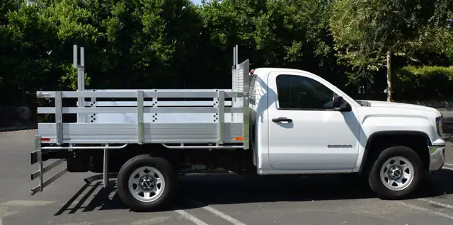 2016 GMC 1500, with a 6'6''x9' aluminum body, 22" fold down gates, custom pipe rack, and dock bumper.