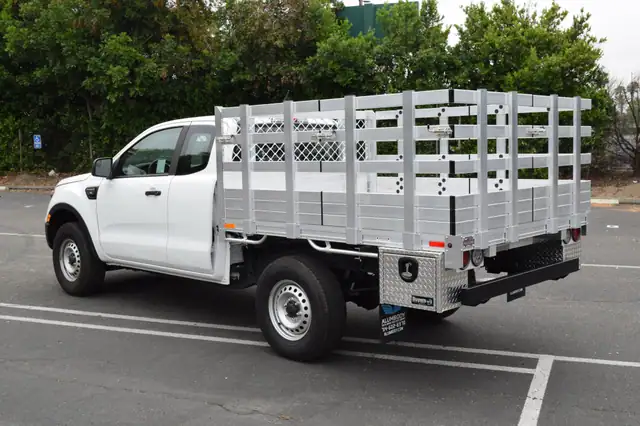 2019 Ford Ranger 6’x7’ aluminum stake bed with 33″ lift-out stakes, 2 tool boxes 14x12x18, and dock bumper