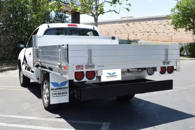 2010 Toyota Tacoma with a 6' × 7' Alumbody aluminum pool truck bed with 9" solid fold-down gates using stainless steel hardware and dock bumper