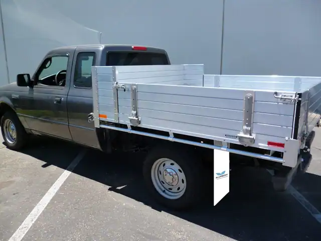2008 Ford Ranger with custom 6' × 6'6" Alumbody aluminum flat bed with 12" fold-down gates using the factory bumper