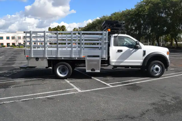 2020 F450 with an 8×12 aluminum bed with 41" lift-out stakes, 2 underbody toolboxes, cone drop support, beacon strobe flood arrow board rack, dock bumper and hitch