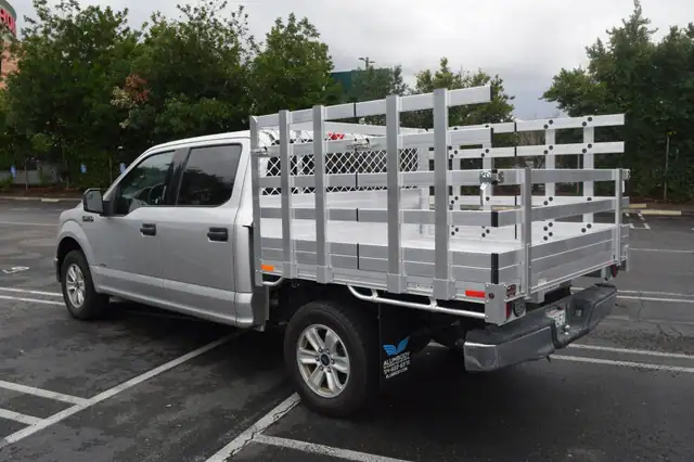2018 Ford F150 66 X 6 Aluminum Stake Bed with 38 Lift Out Sides 22 fold down rear using the Factory Bumper