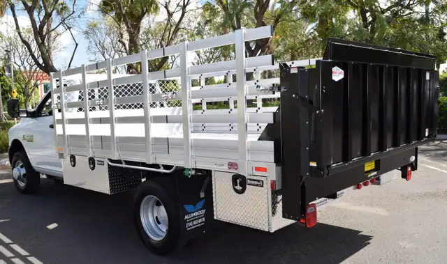 2016 Ram 3500 Dual Rear Wheel with an 8' × 12' Alumbody aluminum stake bed with 38" lift-out stakes, 4 underbody toolboxes and Tommygate lift gate