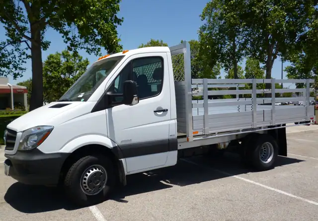 2013 Mercedes-Benz Sprinter 3500 DRW with a 7' X 12' Alumbody aluminum flat bed with 22" fold down gates and dock bumper