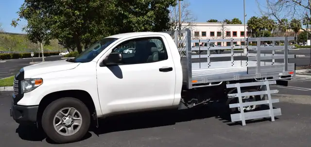 2017 Toyota Tacoma with a 6'X7' Alumbody stake bed with 33" lift-out gates and dock bumper