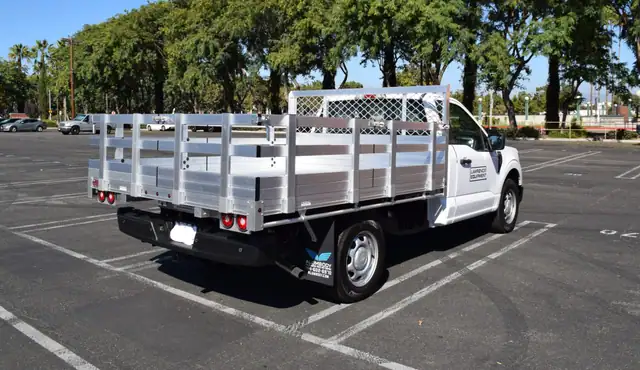 2021 F150 with a 7 x 9 Aluminum Bed with 22 Lift Out Stakes using the Factory Bumper 1
