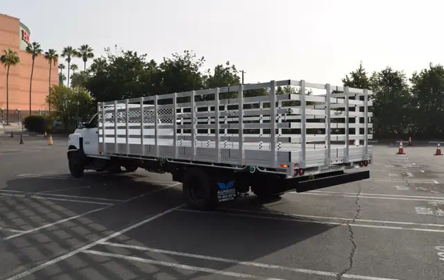 2020 Ford F550 8X206 aluminum stake bed with 46 lift out stakes and dock bumper