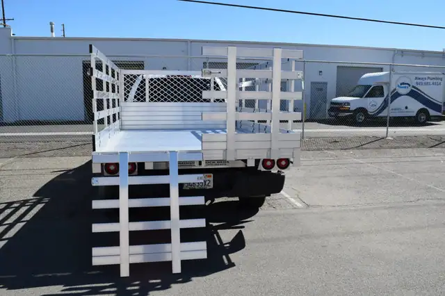 2020 Toyota Tundra, 6'6" x 9' aluminum stake bed with 38" lift-out gates, using the factory bumper