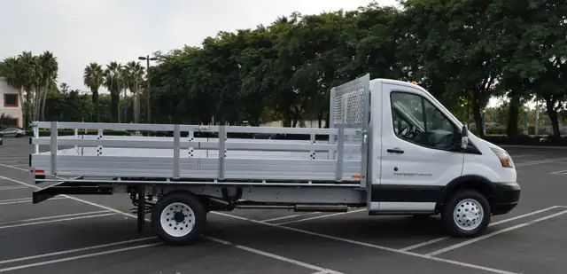 2019 Ford Transit 76x14 aluminum flatbed with 22 fold down gates and dock bumper