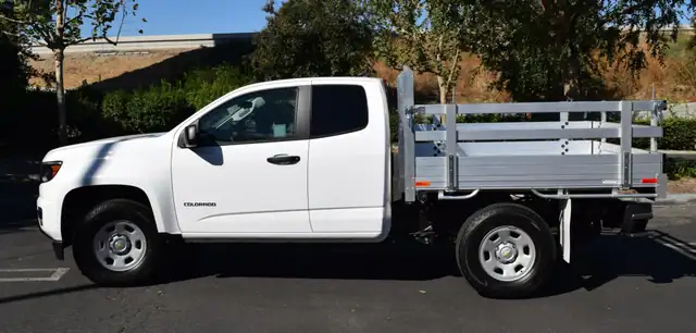 2017 Chevy Colorado 6 X 66 with an aluminum flat bed 22 fold down gates using the factory bumper. Showing drivers side.