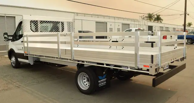 2020 Ford Transit 76x16 aluminum flatbed with 22 fold down gates and dock bumper