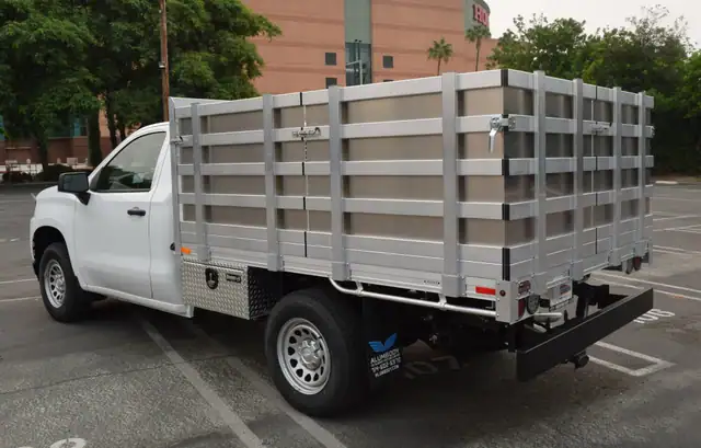 2020 Chevy Silverado 1500 66×9 aluminum stake bed with 38" lift-out stakes using aluminum sheet to create solid gates and dock bumper