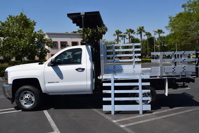 2016 Chevy 2500 with Alumbody aluminum traffic control body with 38" lift-out stakes and 22" fold-down sides with 22" barn-door rear