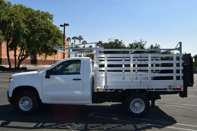 2021 Chevy 1500 66×9 aluminum stake bed with 38" lift-out sides, lift gate in the rear and rack