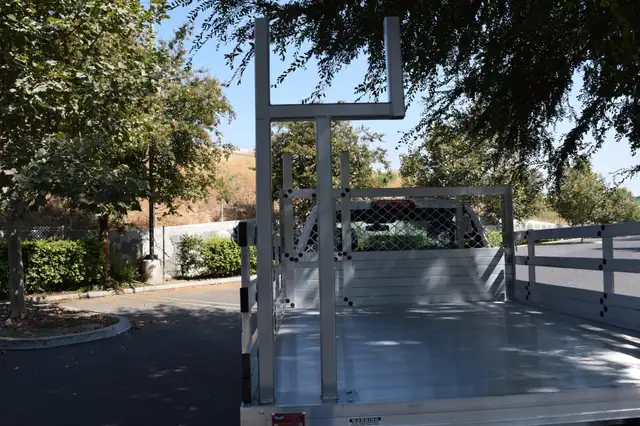 2016 GMC 1500 with Alumbody aluminum flat bed and a custom pipe rack